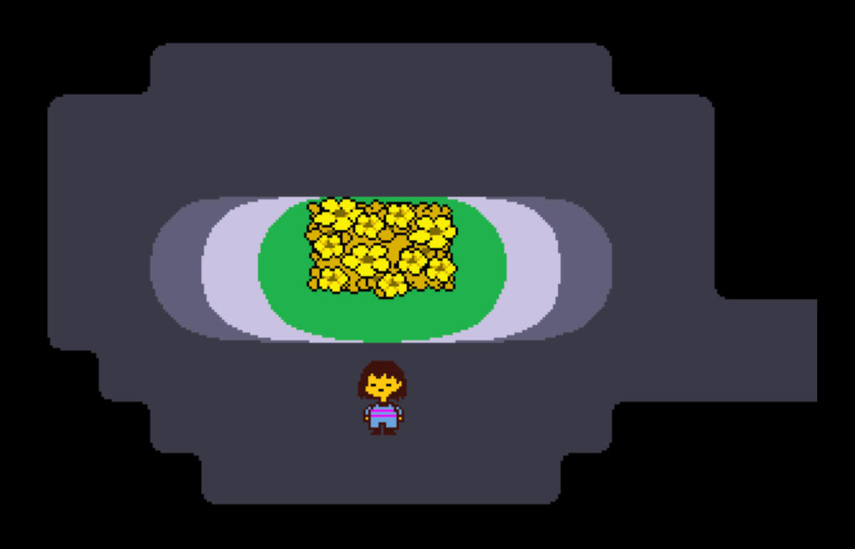 A screenshot from the video game Undertale. It depicts what might be a child, wearing a striped shirt, standing in an underground cavern. In the centre, illuminated in light from above, is a small patch of grass covered in yellow flowers. The graphics of t